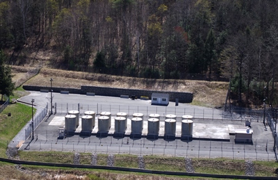 Aerial view of the Independent Spent Fuel Storage Installation, showing the 16 dry storage casks in their fenced enclosure and an admin/monitoring building